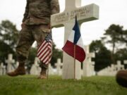 Why Americans Still Cross the Atlantic for Omaha Beach: Inside Normandy’s Most Powerful Journey French and American flags beside a white cross at Normandy American Cemetery