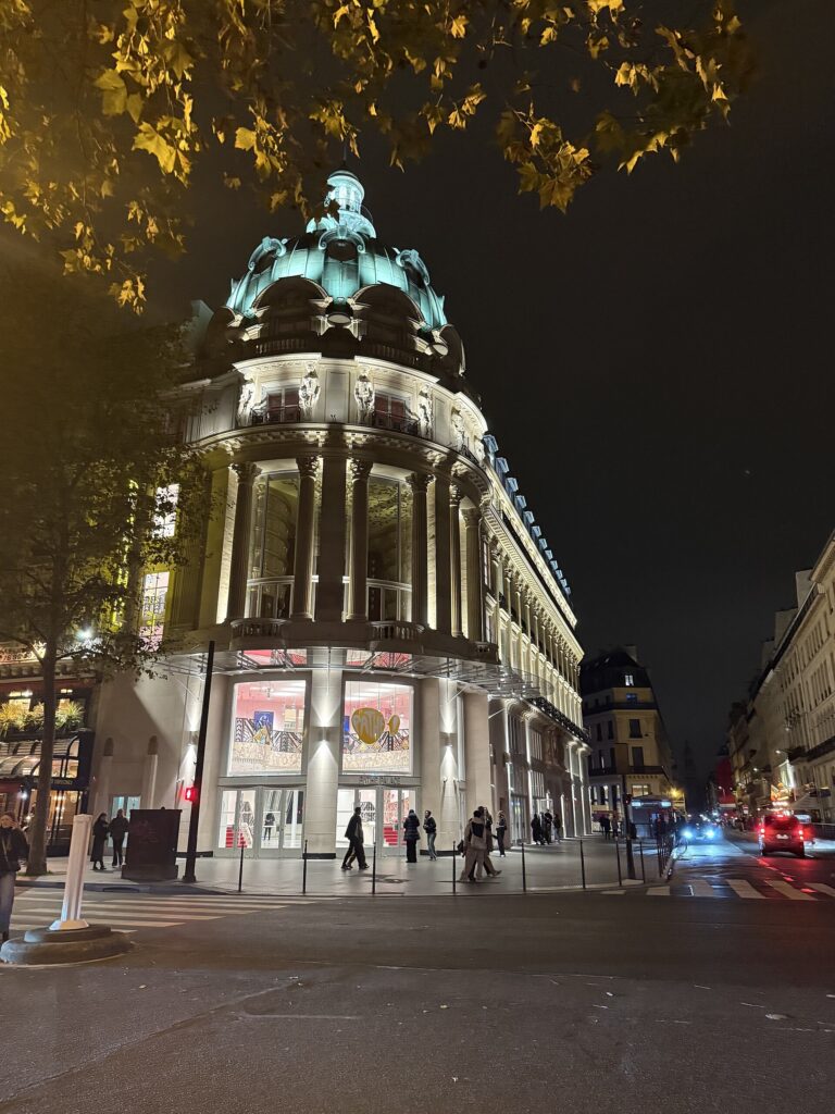 Illuminated Pathé Palace cinema exterior in Paris at night