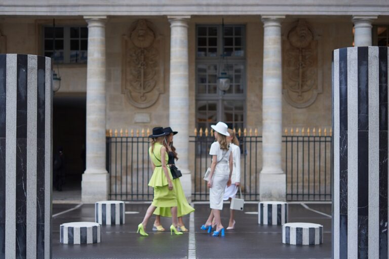 Elegant models presenting a collection at Palais-Royal during Paris Fashion Week