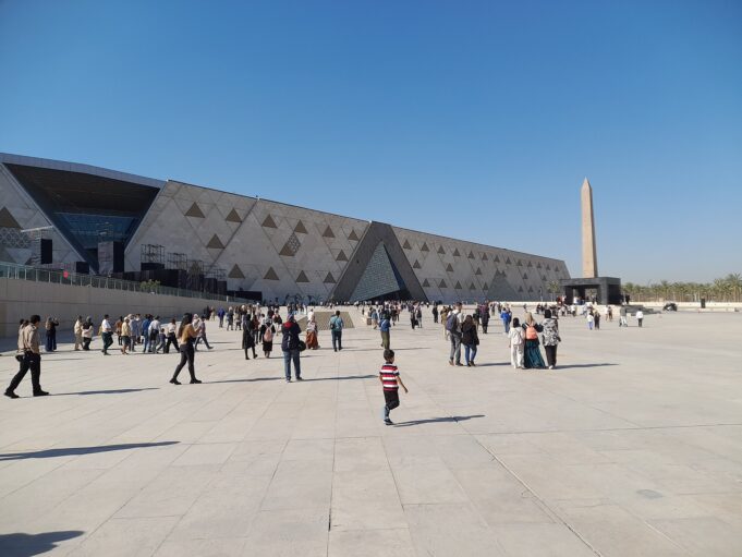 Grand Egyptian Museum Exterior in Giza Grand Egyptian Museum modern exterior with visitors in Giza, Egypt