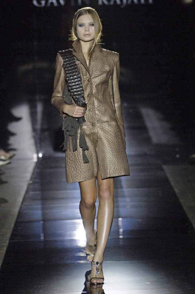 Model presenting an elegant haute couture look on a Paris runway
