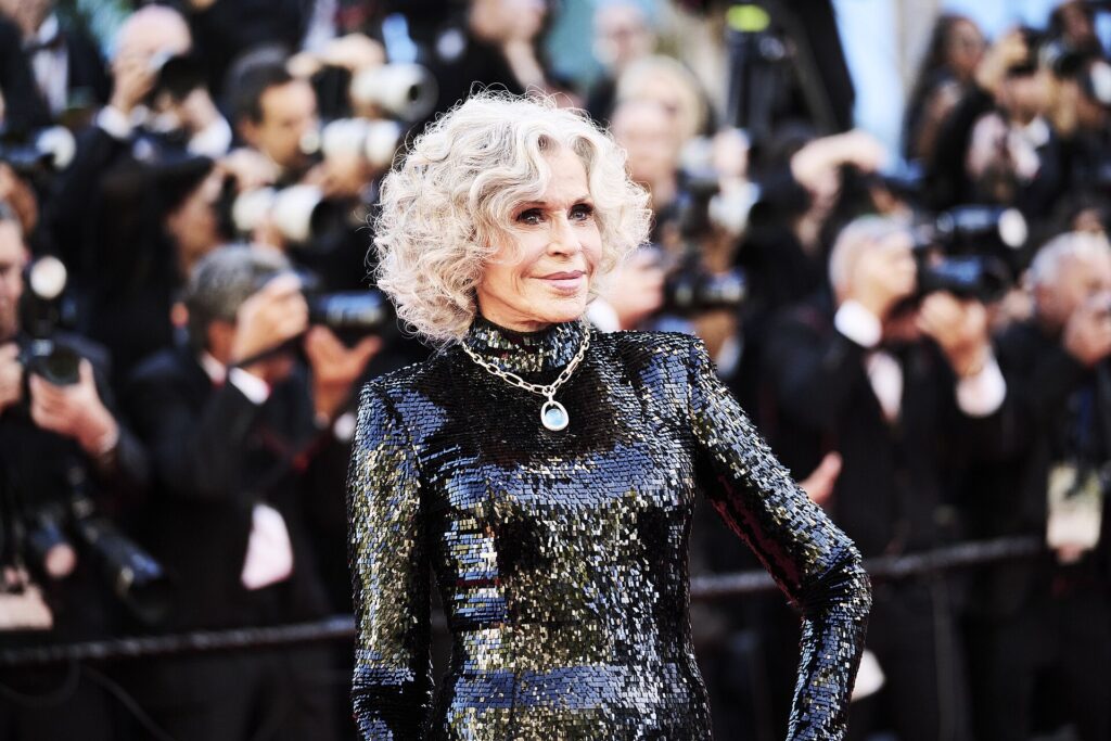Jane Fonda surrounded by photographers at the 2026 Cannes Film Festival