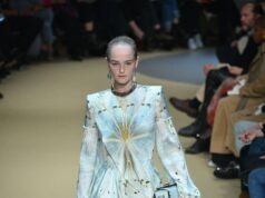 Inside Paris Fashion Week 2026: Dates, Venues & the Luxury Visitor Guide Model Jean Campbell walking an Alexander McQueen runway at Paris Fashion Week