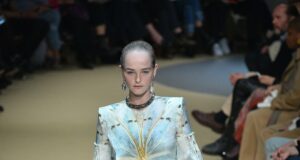 Inside Paris Fashion Week 2026: Dates, Venues & the Luxury Visitor Guide Model Jean Campbell walking an Alexander McQueen runway at Paris Fashion Week