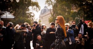 Women’s Paris Fashion Week 2026: The Dates, Shows & Secrets Worth Knowing Elegant guest arriving amid photographers at Women's Paris Fashion Week