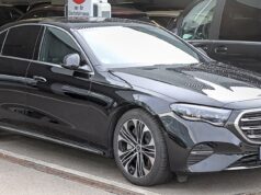 When Paris Gets Busy, One Car Is Not Enough: Inside the Chauffeur Fleets Moving Major Events Modern black Mercedes E-Class with other premium vehicles in a Paris chauffeur fleet