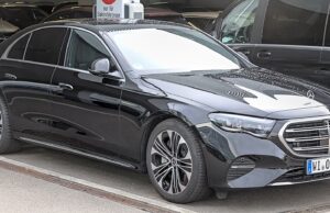 When Paris Gets Busy, One Car Is Not Enough: Inside the Chauffeur Fleets Moving Major Events Modern black Mercedes E-Class with other premium vehicles in a Paris chauffeur fleet