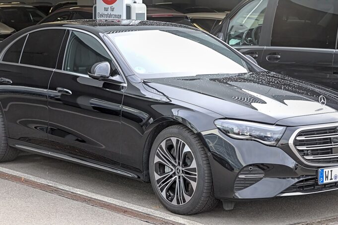 Modern Black Mercedes E-Class Leading a Chauffeur Fleet Modern black Mercedes E-Class with other premium vehicles in a Paris chauffeur fleet