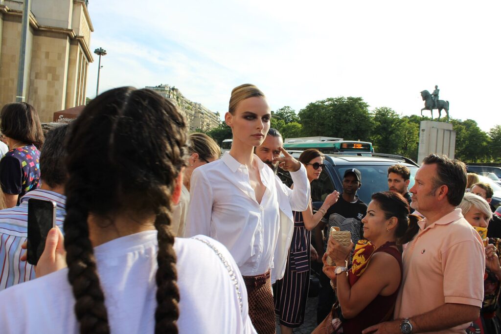 Model Elza Matiz surrounded by visitors during Paris Fashion Week