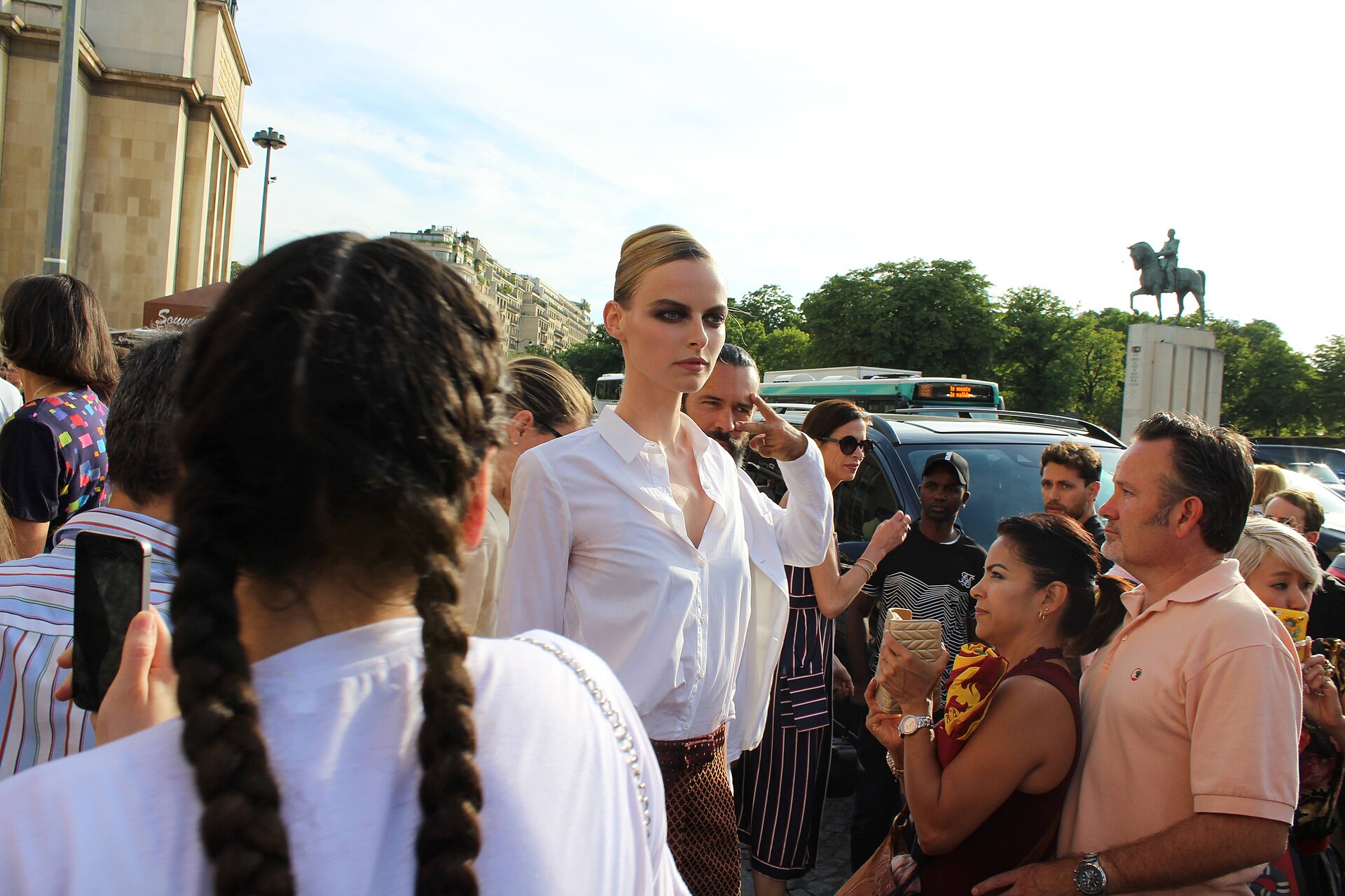 Model Elza Matiz surrounded by visitors during Paris Fashion Week