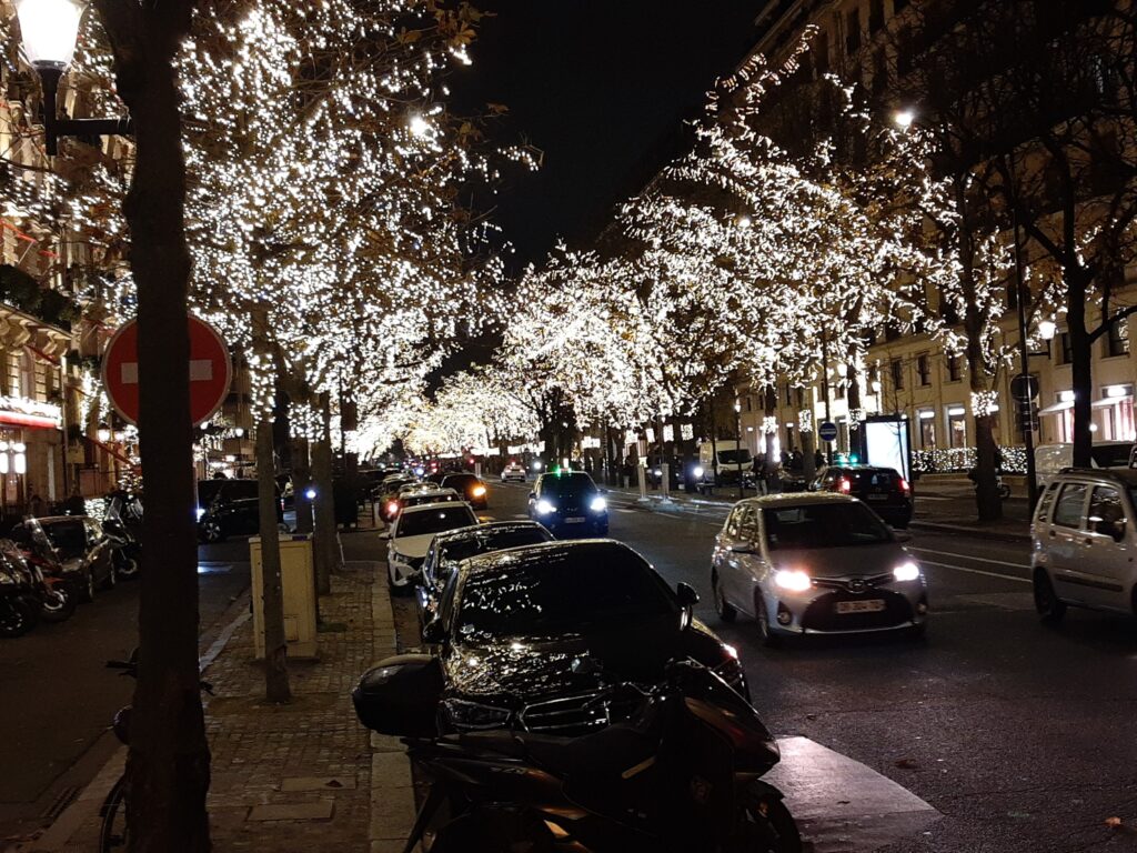 Illuminated Avenue Montaigne in the Golden Triangle luxury hotel district of Paris