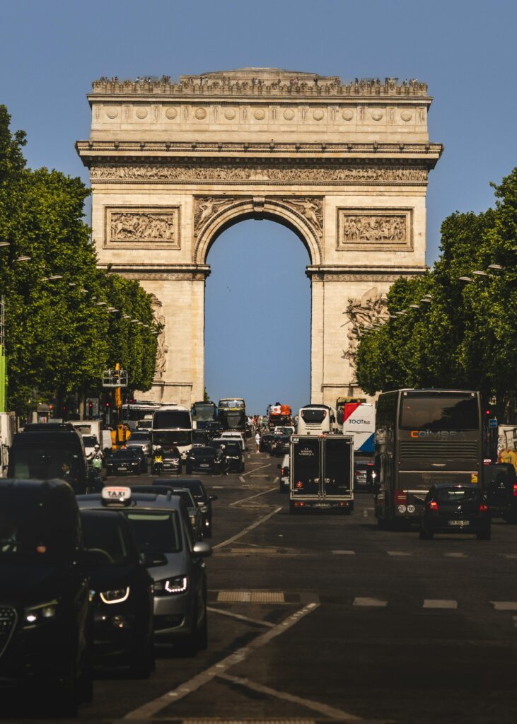 Champs-Élysées streetscape near the Louis Vuitton Paris project and Arc de Triomphe in 2026