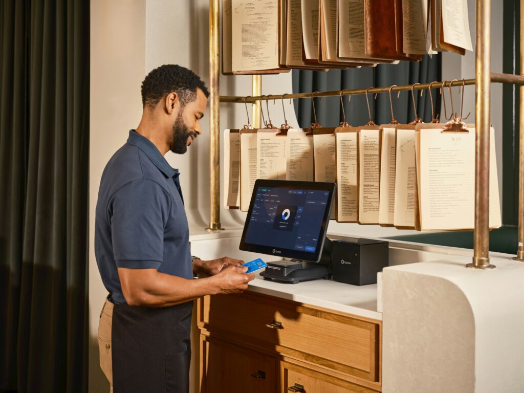 Hospitality professional using a digital reservation and payment system