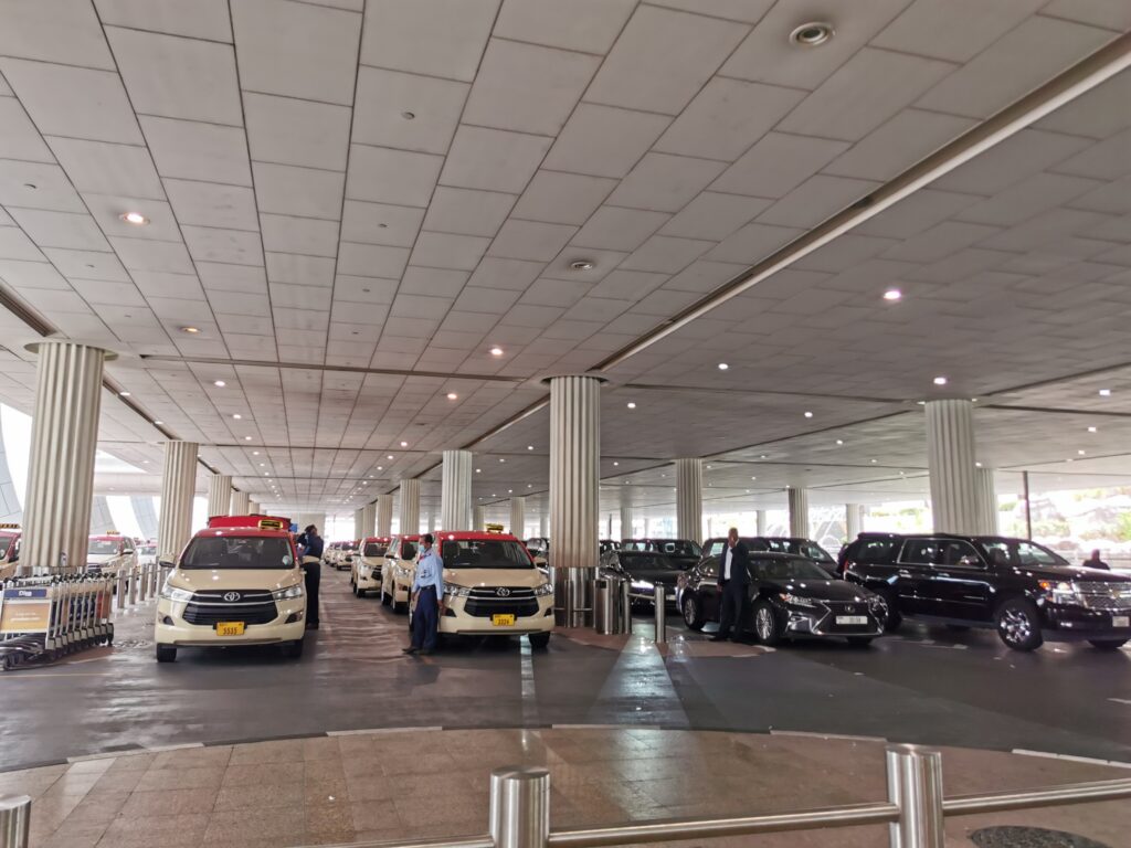 Licensed Dubai airport taxi representing regulated tourism transport at a global aviation hub