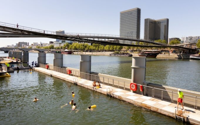 Swimming in the Seine at Bercy, Paris 2026 Swimmers at the Bercy Seine bathing site with the Bibliothèque nationale de France in view