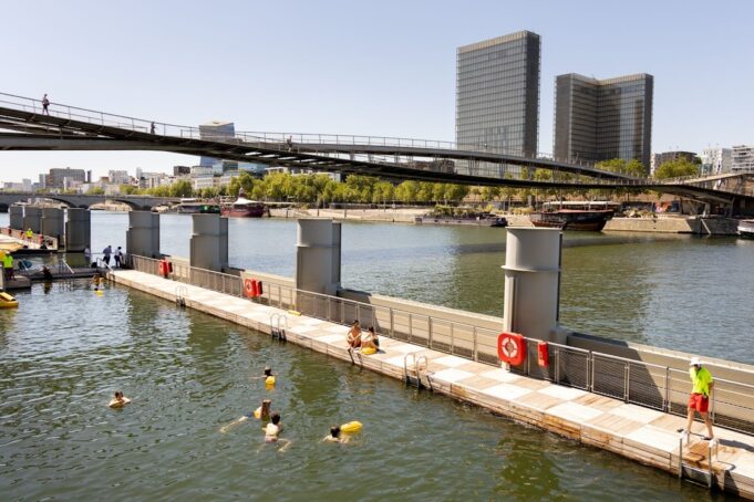 Swimming in the Seine at Bercy, Paris 2026 Swimmers at the Bercy Seine bathing site with the Bibliothèque nationale de France in view
