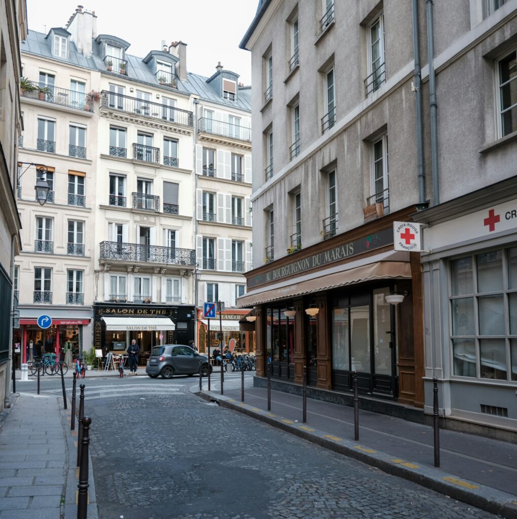 Historic street in Le Marais for travellers choosing boutique luxury hotels in Paris