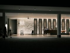 Hospitality Is More Than Service: The Skills Every Hotel and Tourism Professional Must Master Hospitality professionals welcoming guests at a luxury hotel reception desk