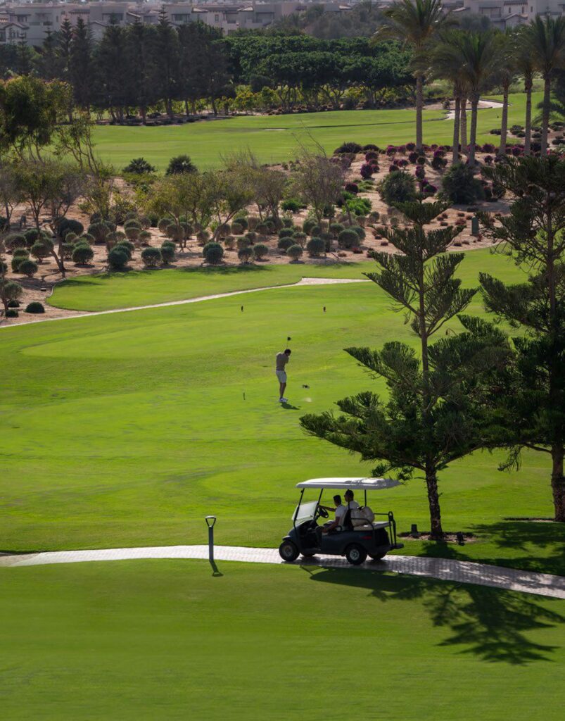 Golfer on the 18-hole Peter Harradine golf course at Marassi North Coast Egypt
