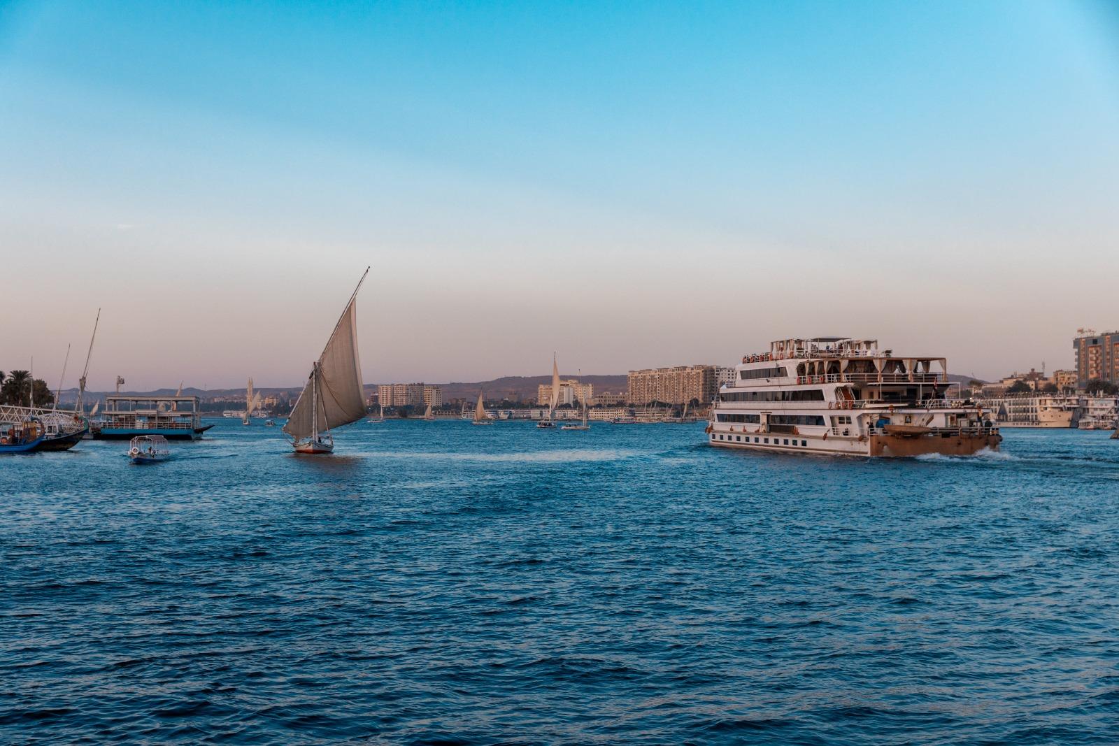 Nile cruise ship and feluccas illustrating Egypt travel demand