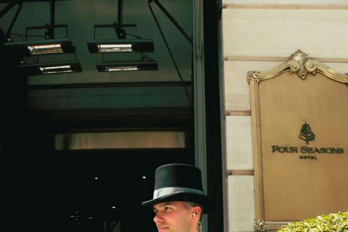 Professional Arrival Host Outside a Luxury Hotel Professional arrival host illustrating tourism transport quality and luxury hospitality standards