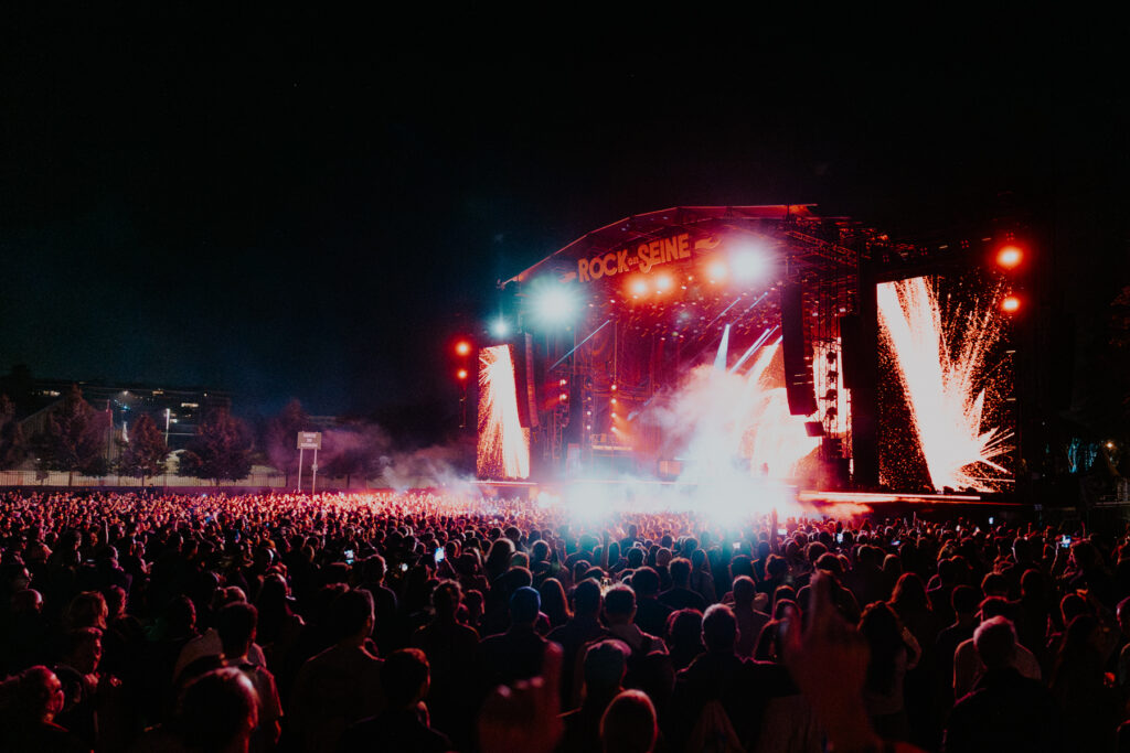 Festival audience and illuminated stage at Rock en Seine in Saint-Cloud