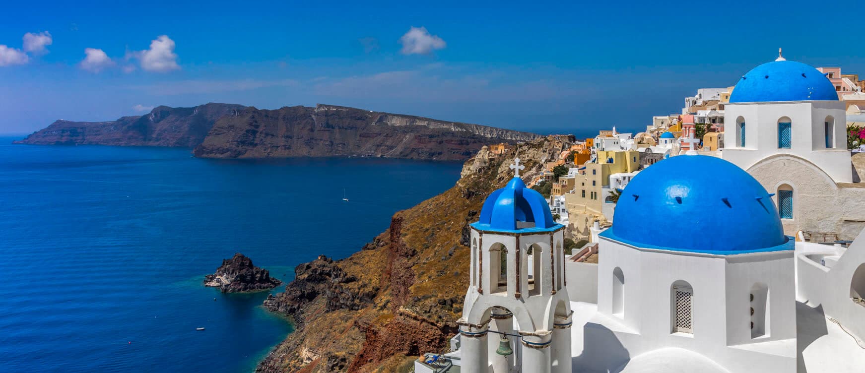 Oia overlooking the Santorini caldera in the 2027 luxury beach destination forecast