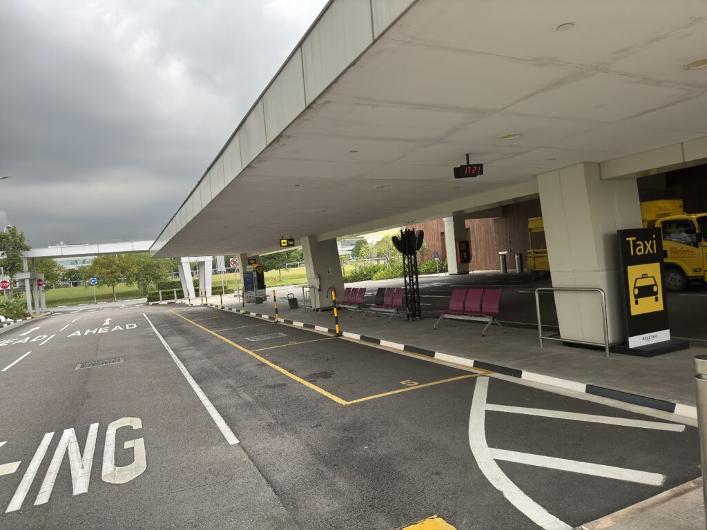 Singapore airport taxi stand illustrating organised tourism transport and airport integration