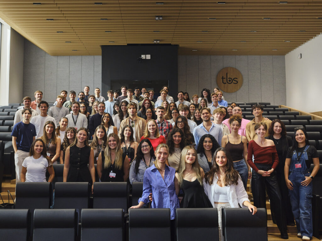 International students assembled in a modern TBS Education lecture theatre
