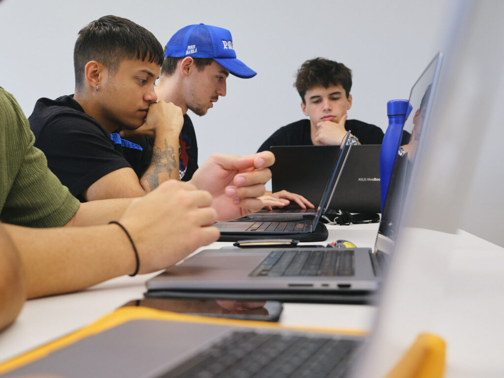 TBS Education students preparing a collaborative digital application project