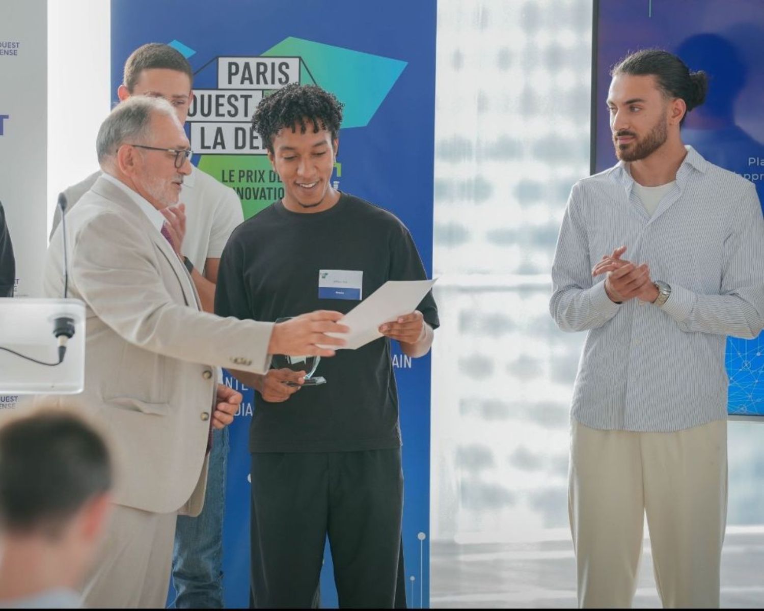 Students receiving an innovation award relevant to digital tourism management careers