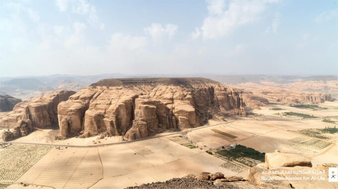 Hegra AlUla Heritage Landscape Hegra rock-cut tombs in AlUla Saudi Arabia, an official Royal Commission for AlUla media image used to illustrate the destination investment analysis.