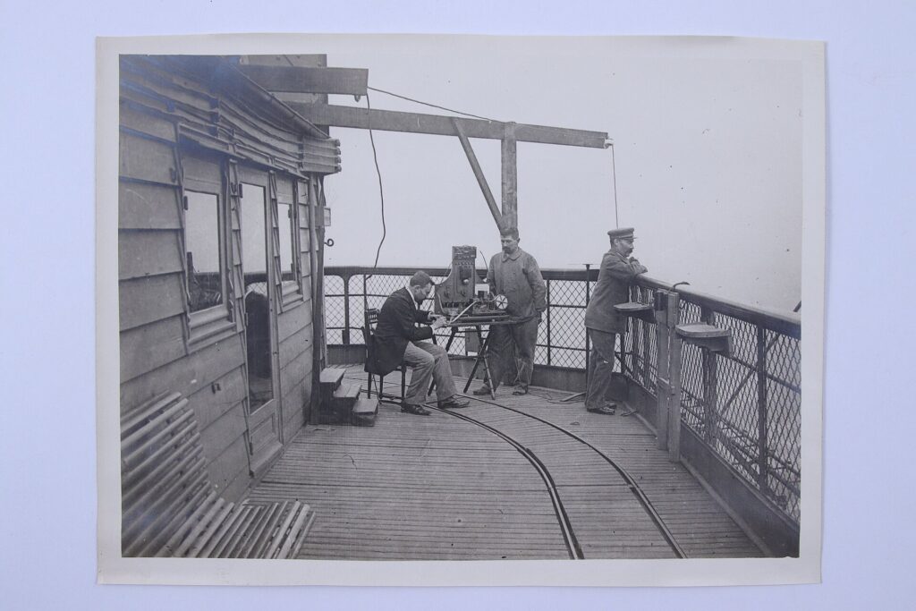 Engineers conducting the first wireless radio link from the Eiffel Tower in 1898