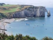 Europe Is Getting Hotter. Is Northern France Becoming Summer’s Smartest Escape? Summer view over Étretat beach and chalk sea arch in Normandy with sailing boats offshore
