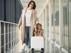 CDG Airport to Disneyland Paris with Children and Luggage: The 2026 Family Arrival Guide CDG to Disneyland Paris with children: mother and child with luggage at an airport