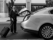 How to Choose a Ground Transportation Partner in France: The 2026 Guide for Travel Agencies, Hotels & Event Planners Professional chauffeur loading luggage into a premium sedan for a business transfer in France
