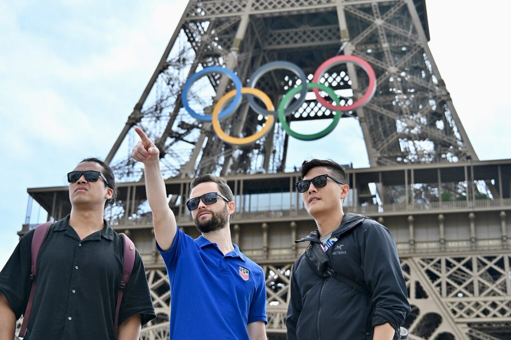 Diplomatic security personnel survey the Eiffel Tower area during the Paris 2024 Olympic Games