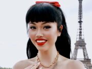 Paris in September 2026: The Month the World Comes Back to Paris Fashion guest in a red dress at Trocadéro during Paris Fashion Week