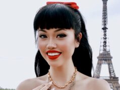 Paris in September 2026: The Month the World Comes Back to Paris Fashion guest in a red dress at Trocadéro during Paris Fashion Week