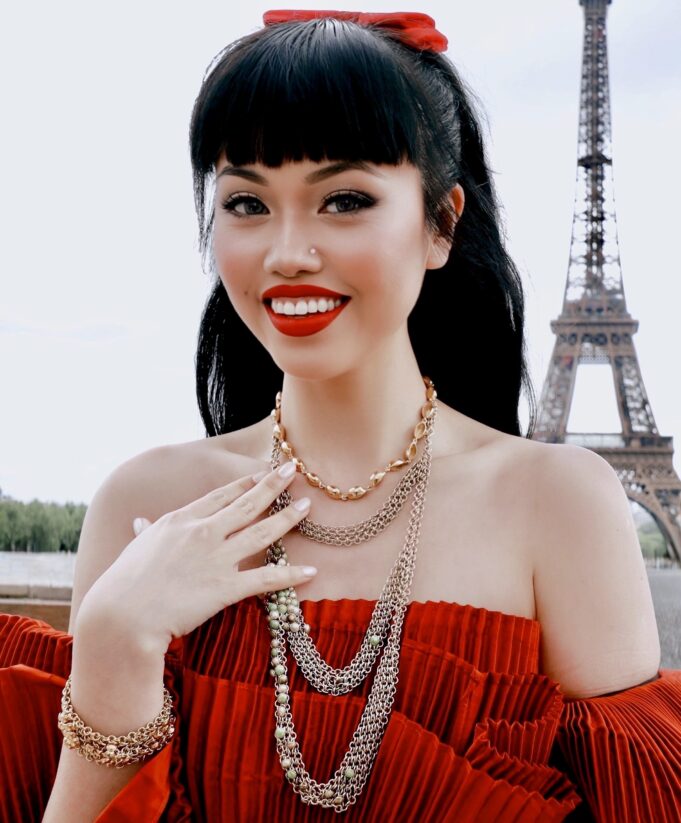 Paris Fashion Week at Trocadéro in 2025 Fashion guest in a red dress at Trocadéro during Paris Fashion Week