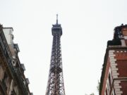 Why Paris Is Still the World’s Tourism Capital in 2026 The Eiffel Tower rising above a Paris street in 2025