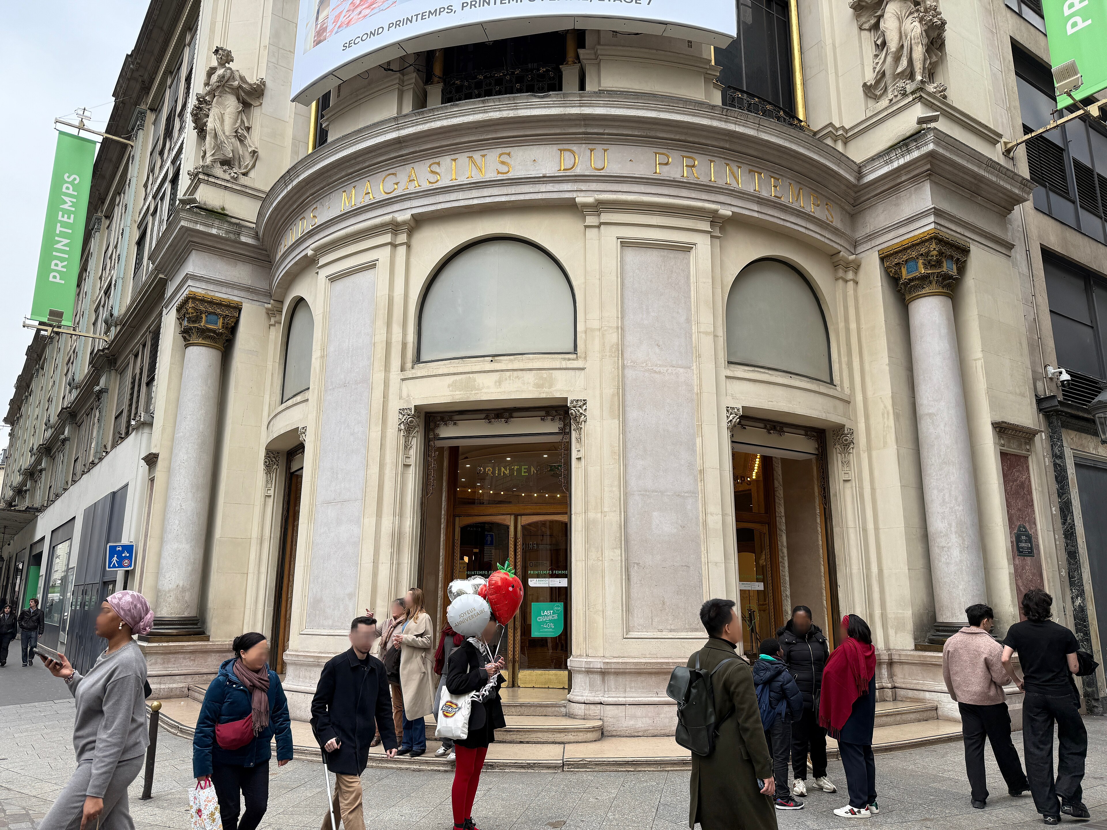 Visitors at the Printemps Haussmann department-store entrance in Paris