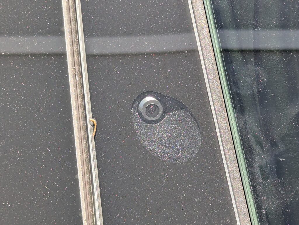 Tesla exterior camera used by driver-assistance vision systems