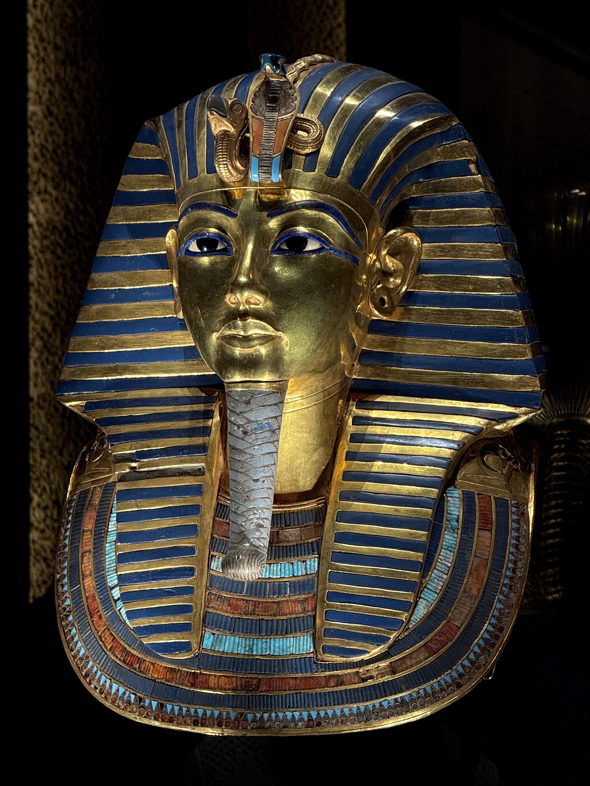 The golden burial mask of Tutankhamun with blue inlay details