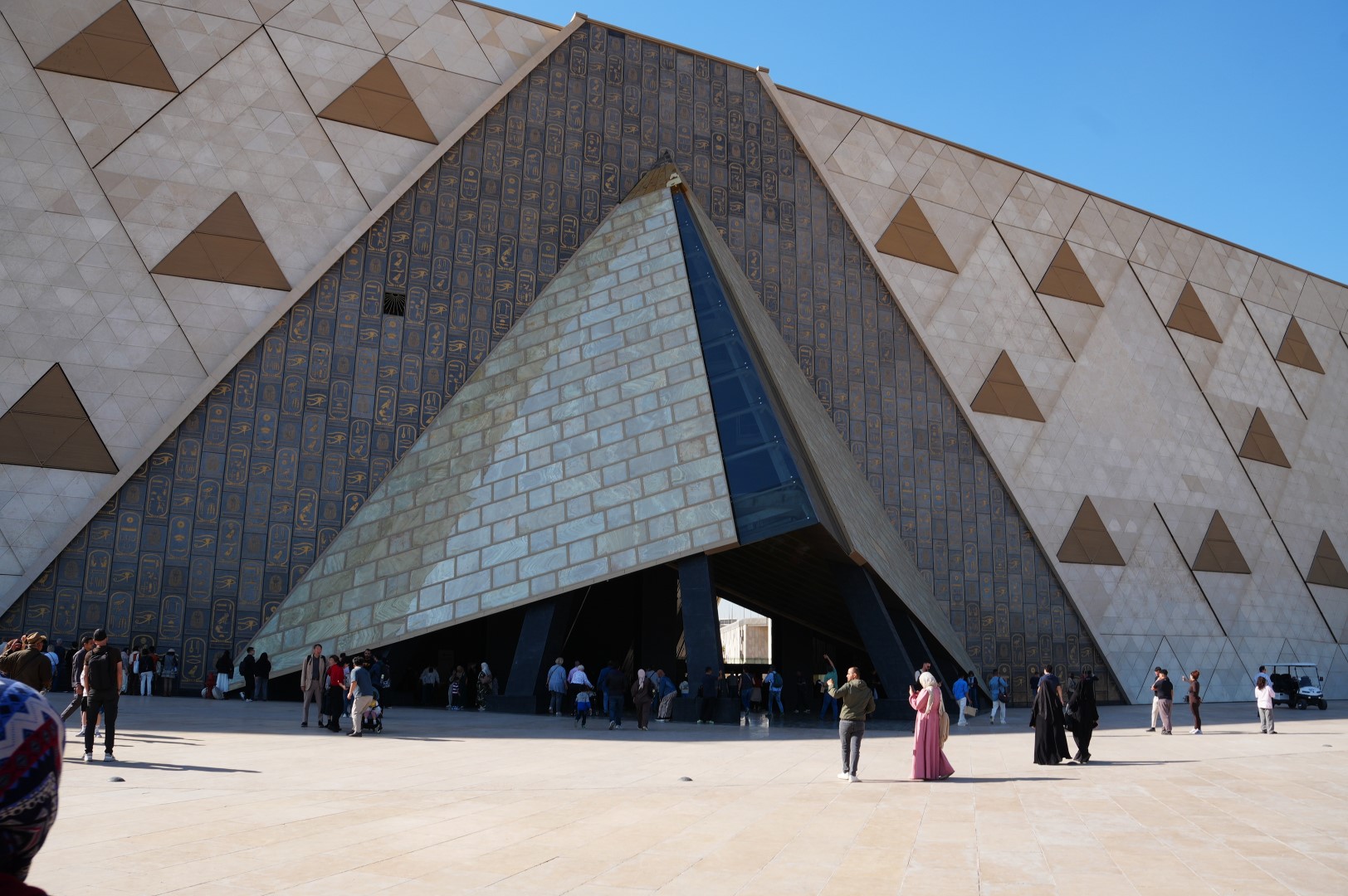 The architectural entrance façade of the Grand Egyptian Museum in Giza