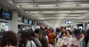 The Arrival-Time Atlas 2026: How Long Does It Really Take to Enter the World’s Major Airports? Travellers wait in the immigration queue at Hong Kong International Airport in July 2025.