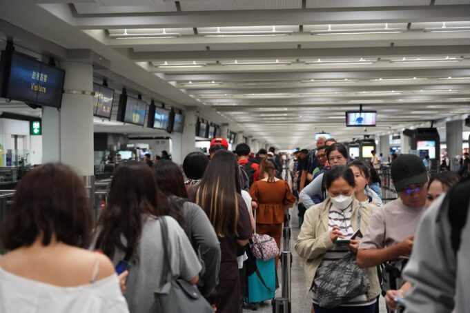 Passport-control queue at Hong Kong International Airport Travellers wait in the immigration queue at Hong Kong International Airport in July 2025.