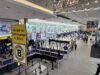 The Suitcase That Went to the Airport but Did Not Fly Real photograph of an organized airport security checkpoint and passenger queues