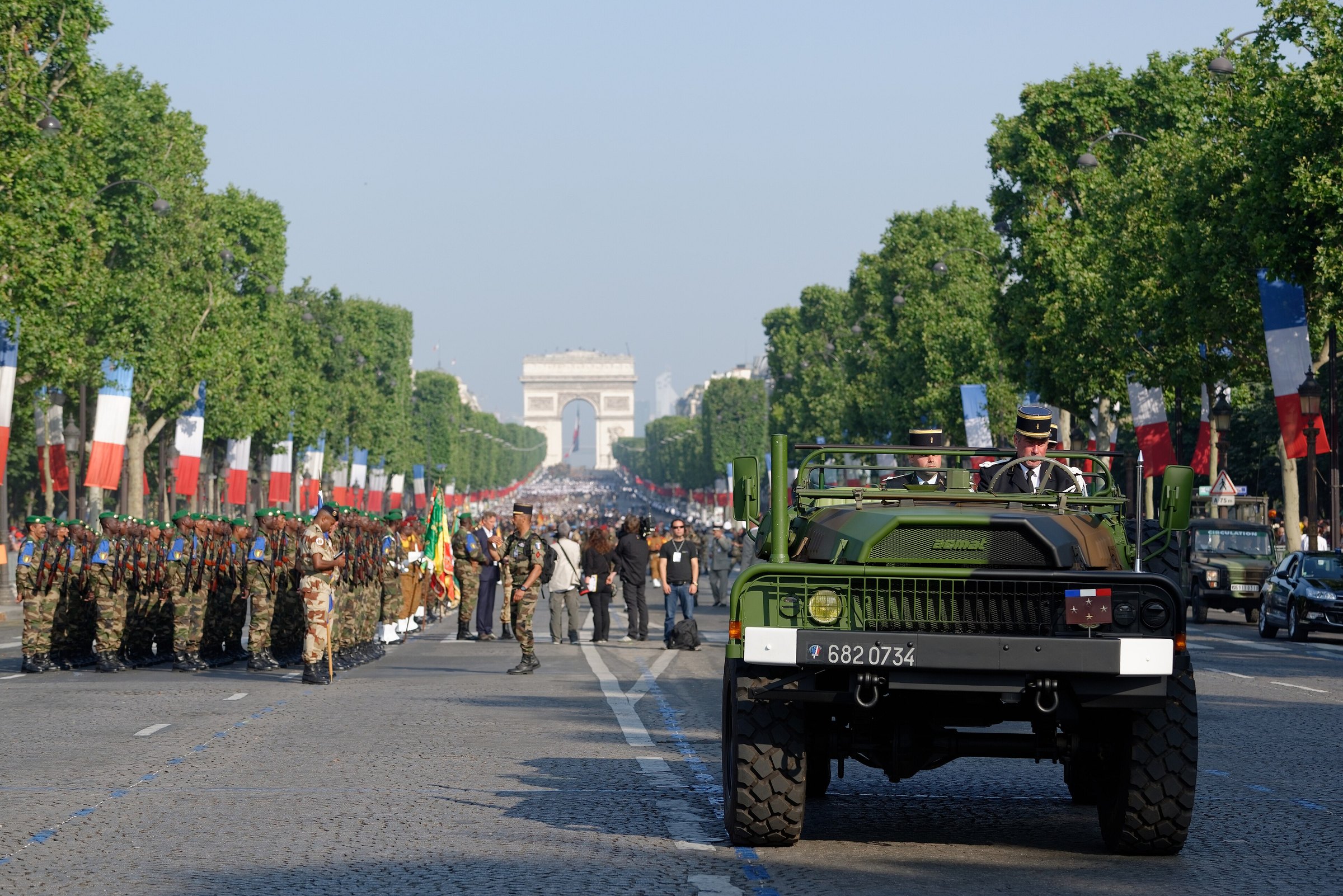 Troops and a military vehicle on the Champs-Elysees before the 2013 Bastille Day parade