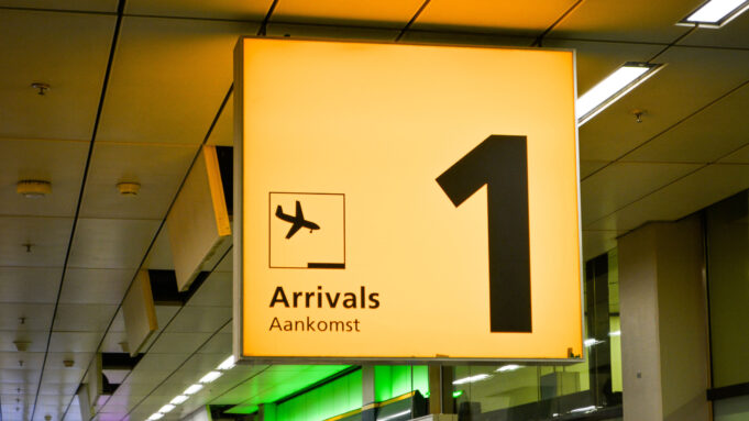 Airport arrivals corridor symbolising the journey from aircraft door to the public hall in Paris, Dubai and Cairo